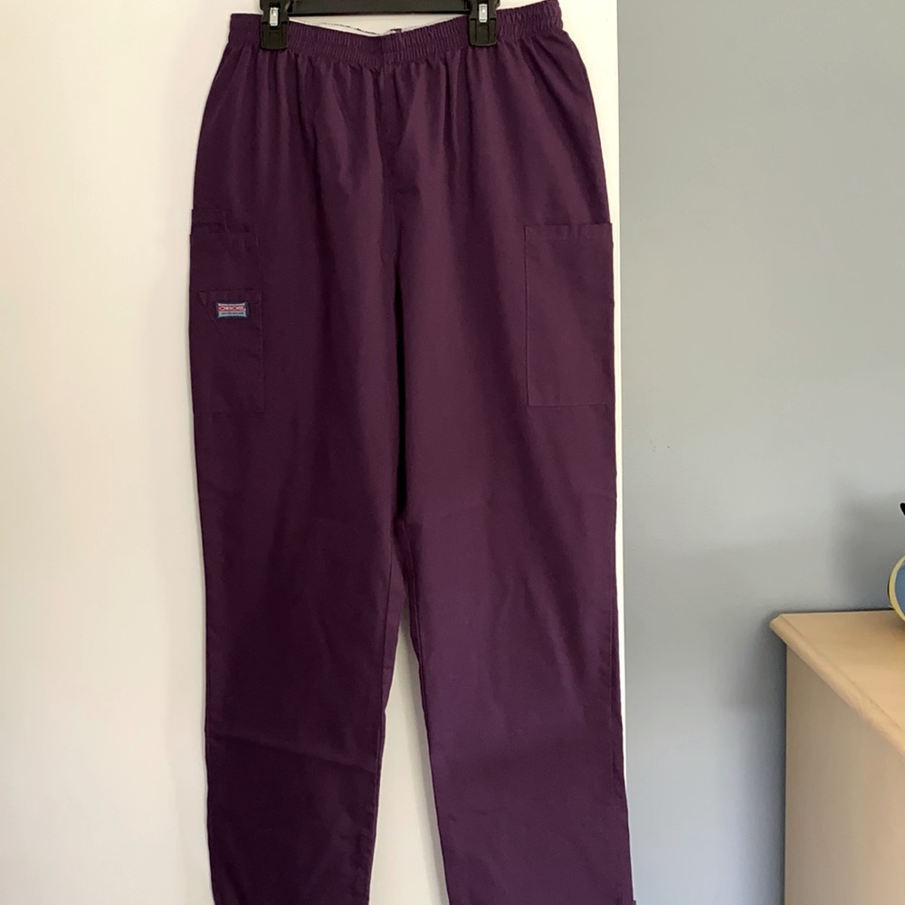 Plum colored scrub pants with side pockets